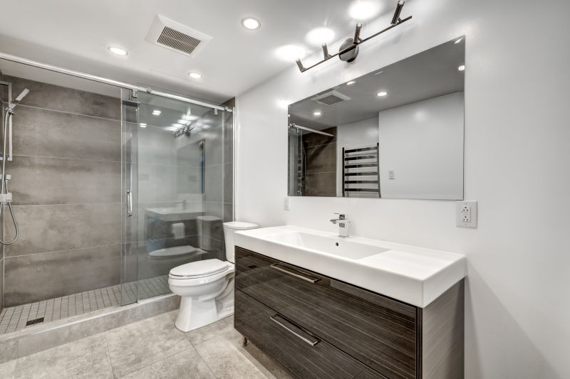 Bathroom with stylish lighting and mirrors
